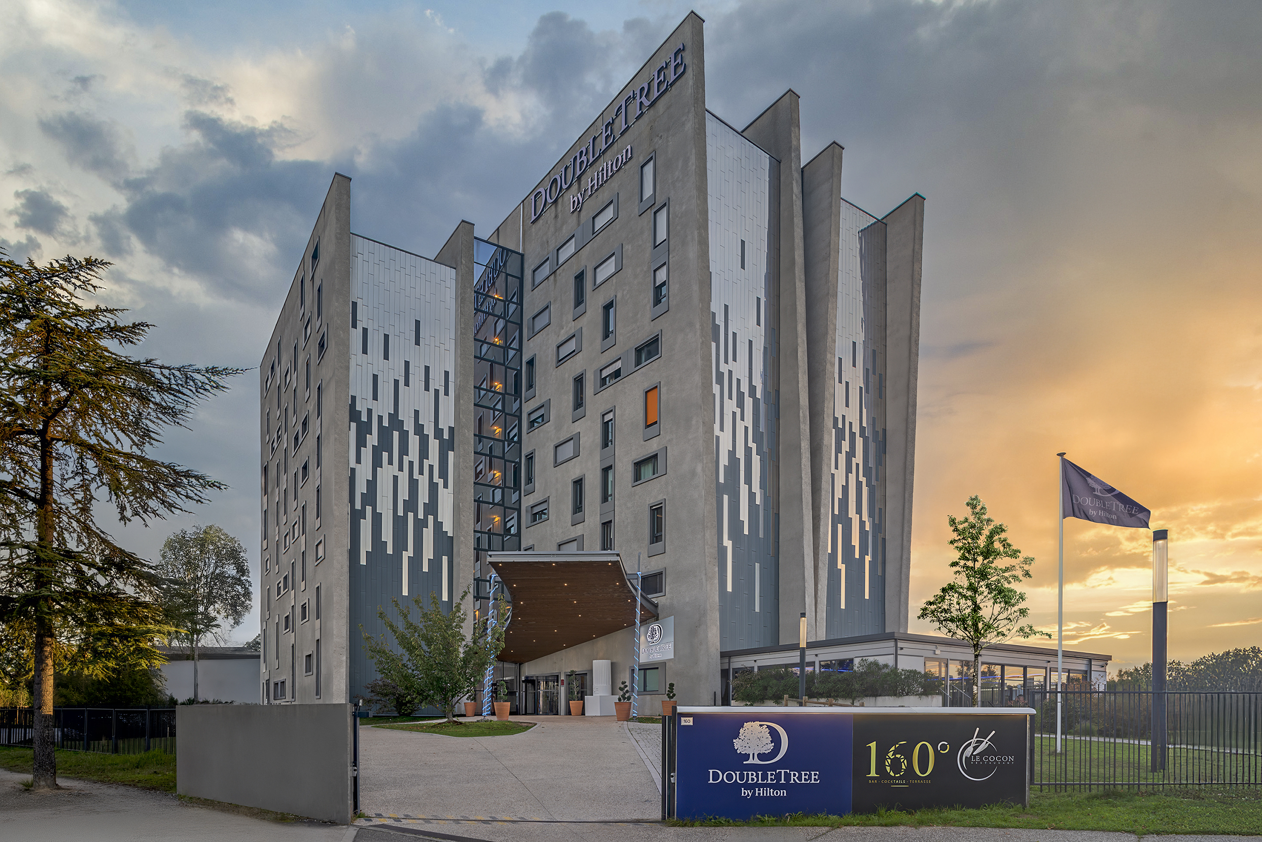 DoubleTree by Hilton hotel exterior photographed at dusk