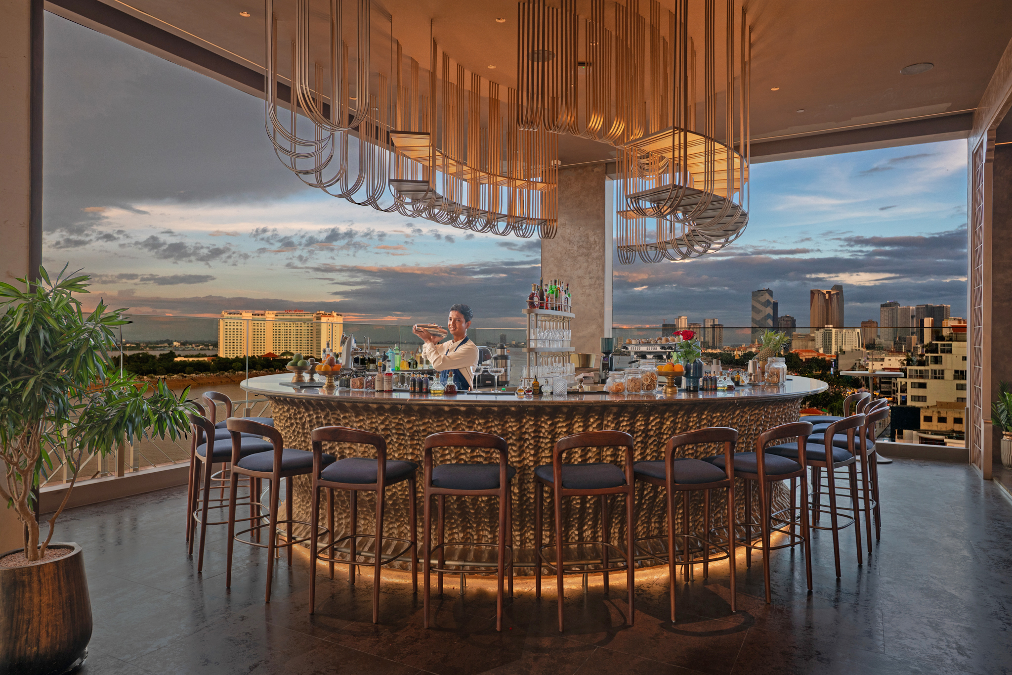 Soma Hotel Riverside rooftop bar at sunset, hospitality and lifestyle photography in Phnom Penh.